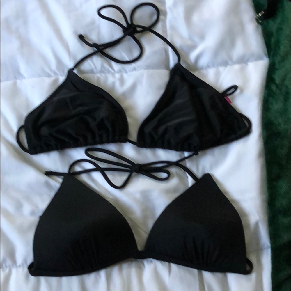 Black triangle bikini tops. Light worn.